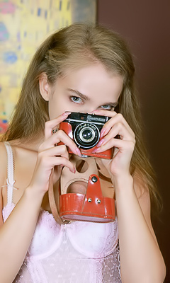 Xenia Glancing Back Over Her Shoulder With A Flirtatious Smile