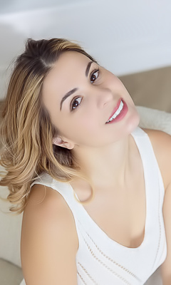 Alice Kelly Dark-eyed Siren Smiles Enticingly As The Straps Slide From Her Shoulders