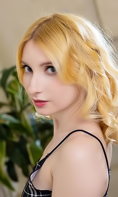 Minnie Lighter Squeezing Her Gorgeous Breasts And Smiles Seductively