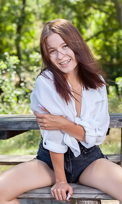 Skye Bloom Perching On A Picnic Table In The Park