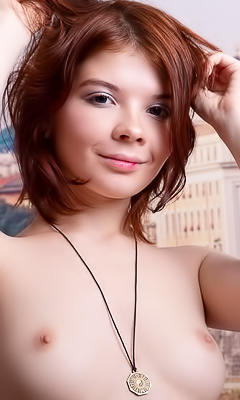 Renzi Teasing Herself Against Satin Sheets
